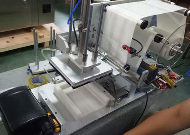 Semi-automatic flat labeling machine